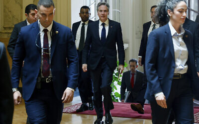 US Secretary of State Antony Blinken, center, walks to meet with Egyptian Foreign Minister Sameh Shoukry, in Cairo, Egypt, March 21, 2024. (Evelyn Hockstein/Pool Photo via AP)