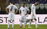 Israel players react at the end of the Euro 2024 qualifying play-off soccer match between Israel and Iceland, at Szusza Ferenc Stadium in Budapest, Hungary, Thursday, March 21, 2024. (AP Photo/Darko Vojinovic)
