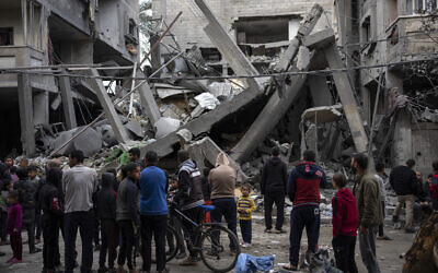 Palestinians inspect the damage of residential buildings after an Israeli airstrike in Rafah, southern Gaza Strip, Sunday, March 24, 2024. (AP Photo/Fatima Shbair)