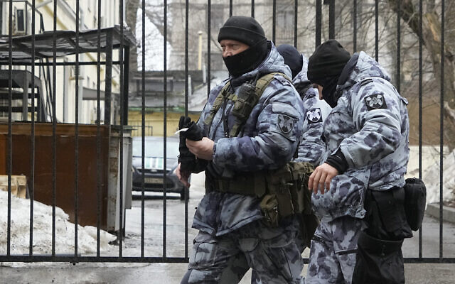 Police officers pass the gate of the Basmanny District Court in Moscow, Russia, Sunday, March 24, 2024. There was a heavy police presence around Moscow's Basmanny District Court on Sunday amid unconfirmed reports to some of the suspects could appear in court. (AP Photo/Alexander Zemlianichenko)
