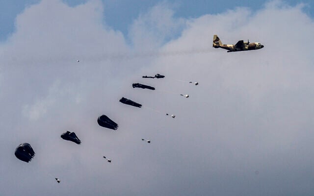 An aircraft airdrops humanitarian aid over the northern Gaza Strip, as seen from southern Israel, March 24, 2024. (AP/Tsafrir Abayov) An aircraft airdrops humanitarian aid over the northern Gaza Strip, as seen from southern Israel, March 24, 2024. (AP/Tsafrir Abayov)