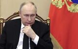 Russian President Vladimir Putin chairs a meeting, discussing measures in response to the terrorist attacks at the Crocus City Hall concert venue, via a video conference at the Novo-Ogaryovo state residence, outside Moscow, Russia, March 25, 2024. (Mikhail Metzel/Sputnik, Kremlin Pool Photo via AP)