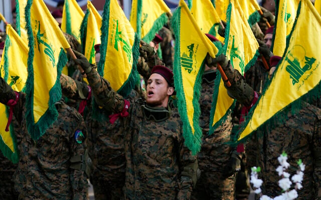 Hezbollah fighters attend the funeral of their commander Wissam al-Tawil, in the village of Khirbet Selm, south Lebanon, January 9, 2024. (AP Photo/Hussein Malla, File)