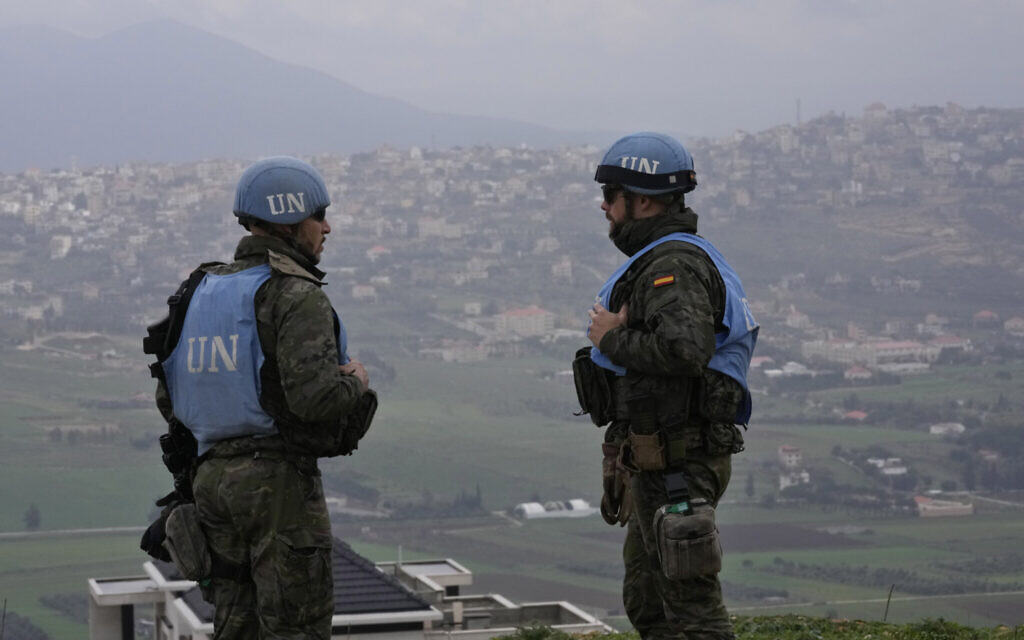 Spanish UN peacekeepers stand on a hill overlooking the Lebanese border villages with Israel in Marjayoun town on January 10, 2024. (AP Photo/Hussein Malla, File)