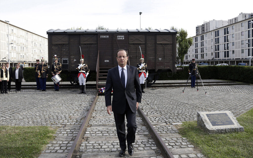 Then-French president Francois Hollande walks back from a train car commemorating the Drancy concentration camp, during the inauguration of a new Holocaust memorial in Drancy, a Paris suburb, France, September 21, 2012. (AP Photo/Philippe Wojazer, Pool)