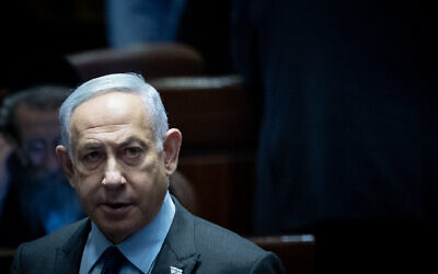 Prime Minister Benjamin Netanyahu arrives to a discussion and a vote on the expulsion of MK Ofer Cassif at the Knesset in Jerusalem, February 19, 2024 (Yonatan Sindel/Flash90).