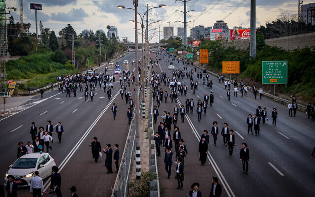 Ultra-Orthodox Jews block Route 4 during a protest against the drafting of Haredim to the IDF, next to Bnei Brak, March 3, 2024. (Itai Ron/Flash90) Ultra-Orthodox Jews block Route 4 during a protest against the drafting of Haredim to the IDF, next to Bnei Brak, March 3, 2024. (Itai Ron/Flash90)