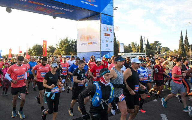 Thousands of runners take part in the annual Jerusalem marathon, March 8, 2024. (Arie Leib Abrams/Flash90) Thousands of runners take part in the annual Jerusalem marathon, March 8, 2024. (Arie Leib Abrams/Flash90)