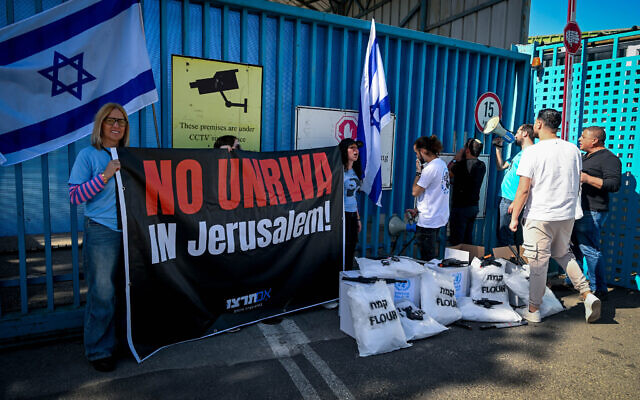 Israelis protest against United Nations Relief and Works Agency for Palestine Refugees (UNRWA) outside their offices in Jerusalem, March 13, 2024. (Arie Leib Abrams/Flash90) Israelis protest against United Nations Relief and Works Agency for Palestine Refugees (UNRWA) outside their offices in Jerusalem, March 13, 2024. (Arie Leib Abrams/Flash90)