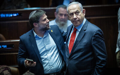 Prime Minister Benjamin Netanyahu and Finance Minister Bezalel Smotrich attend vote at the Knesset in Jerusalem, March 13, 2024. (Yonatan Sindel/Flash90)