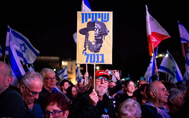 Israelis protest in Tel Aviv for an end to Haredi draft exemptions, March 14, 2024. The placard at center urges an 'equality of burden' in military service. (Avshalom Sassoni/Flash90) Israelis protest in Tel Aviv for an end to Haredi draft exemptions, March 14, 2024. The placard at center urges an 'equality of burden' in military service. (Avshalom Sassoni/Flash90)