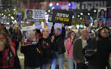 Demonstrators call for a deal to release Israeli hostages held by Hamas in the Gaza Strip, outside the Defense Ministry headquarters in Tel Aviv, March 17, 2024. (Erik Marmor/Flash90)