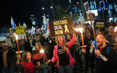 Demonstrators call for the release of Israeli hostages held in the Gaza Strip and against the current Israeli government outside Hakirya Base in Tel Aviv, March 23, 2024. (Erik Marmor/Flash90)