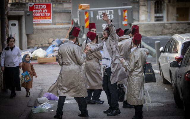 Ultra-Orthodox Jews celebrate the Jewish holiday of Purim in the ultra-Orthodox Mea She'arim neighborhood in Jerusalem on March 25, 2024. (Chaim Goldberg/Flash90) Ultra-Orthodox Jews celebrate the Jewish holiday of Purim in the ultra-Orthodox Mea She'arim neighborhood in Jerusalem on March 25, 2024. (Chaim Goldberg/Flash90)