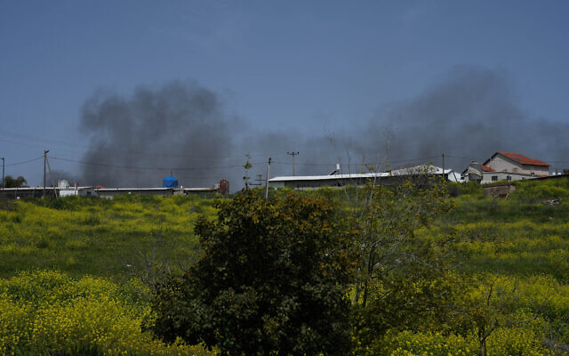 Smoke rises after a rocket fired from Lebanon hit Moshav Avivim, northern Israel, March 26, 2024. (Ayal Margolin/Flash90) Smoke rises after a rocket fired from Lebanon hit Moshav Avivim, northern Israel, March 26, 2024. (Ayal Margolin/Flash90)