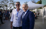Yesh Atid leadership challenger MK Ram Ben Barak (left) and party leader Yair Lapid meet during elections for the leadership in Tel Aviv, March 28, 2024. (Avshalom Sassoni/FLASH90)