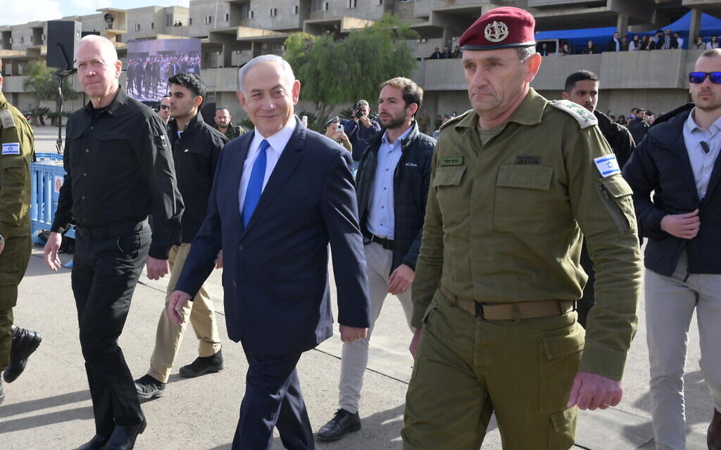 From left: Defense Minister Yoav Gallant, Prime Minister Benjamin Netanyahu and IDF Chief of Staff Lt. Gen. Herzi Halevi at a cadets graduation ceremony at the IDF's officers school in southern Israel, known as Bahad 1, March 7, 2024. (Amos Ben Gershom/GPO)