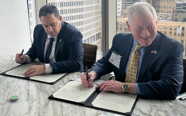 Amit Becher, president of the Israel Bar Association (left), and Richard Lewis, president of the New York State Bar Association, sign a memorandum of understanding between the two associations, March 4, 2024 (Courtesy New York State Bar Association) Amit Becher, president of the Israel Bar Association (left), and Richard Lewis, president of the New York State Bar Association, sign a memorandum of understanding between the two associations, March 4, 2024 (Courtesy New York State Bar Association)