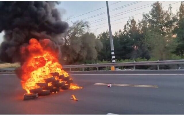 Family members of the hostages block Route 1 on March 8, 2024. (Screen capture/X)