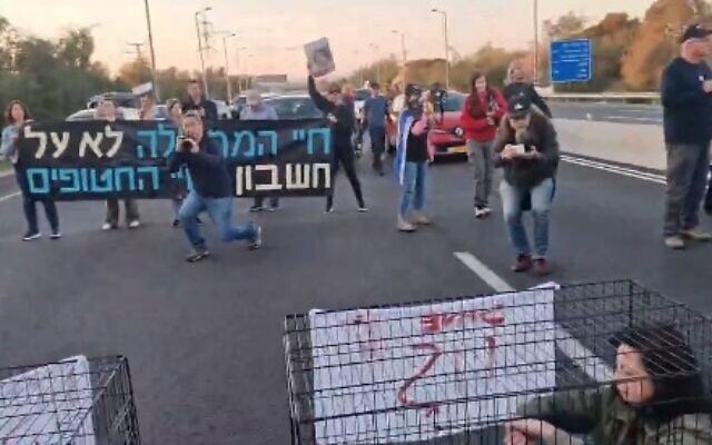 Family members of the hostages block Route 1 on March 8, 2024. (Screen capture/X)