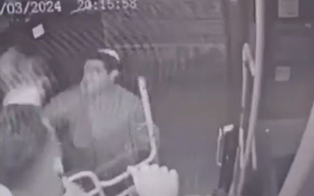 Still image from 'Kavim' bus's security camera footage of youth attacking a bus driver in the West Bank ultra-Orthodox settlement of Modiin Illit, March 24, 2024. (Screen capture: X. Used in accordance with Clause 27a of the Copyright Law) Still image from 'Kavim' bus's security camera footage of youth attacking a bus driver in the West Bank ultra-Orthodox settlement of Modiin Illit, March 24, 2024. (Screen capture: X. Used in accordance with Clause 27a of the Copyright Law)
