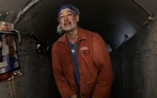 American Jewish rapper Matisyahu in the mock Hamas tunnel at Tel Aviv's Hostages Square, in a still image from the music video for his new song 'Ascent,' released March 29, 2024. Hostage Amiram Cooper, 84, of Kibbutz Nir Oz, is pictured to the singer's left. (Screen capture: Youtube/Matisyahu, used in accordance with Clause 27a of the Copyright Law) American Jewish rapper Matisyahu in the mock Hamas tunnel at Tel Aviv's Hostages Square, in a still image from the music video for his new song 'Ascent,' released March 29, 2024. Hostage Amiram Cooper, 84, of Kibbutz Nir Oz, is pictured to the singer's left. (Screen capture: Youtube/Matisyahu, used in accordance with Clause 27a of the Copyright Law)