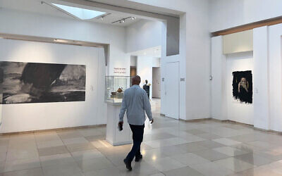 Contemporary artworks share space with ancient artifacts in Bible Lands Museum Jerusalem exhibit 'Splinter from the Storm,' which opened February 2 and closes April 30, 2024 (Jessica Steinberg/Times of Israel)