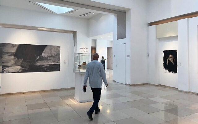 Contemporary artworks share space with ancient artifacts in Bible Lands Museum Jerusalem exhibit 'Splinter from the Storm,' which opened February 2 and closes April 30, 2024 (Jessica Steinberg/Times of Israel)