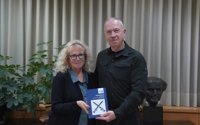 In this handout image published March 11, 2024, Defense Minister Yoav Gallant receives the annual military ombudsman report from Rachel Tevet-Wiesel. (Defense Ministry) In this handout image published March 11, 2024, Defense Minister Yoav Gallant receives the annual military ombudsman report from Rachel Tevet-Wiesel. (Defense Ministry)