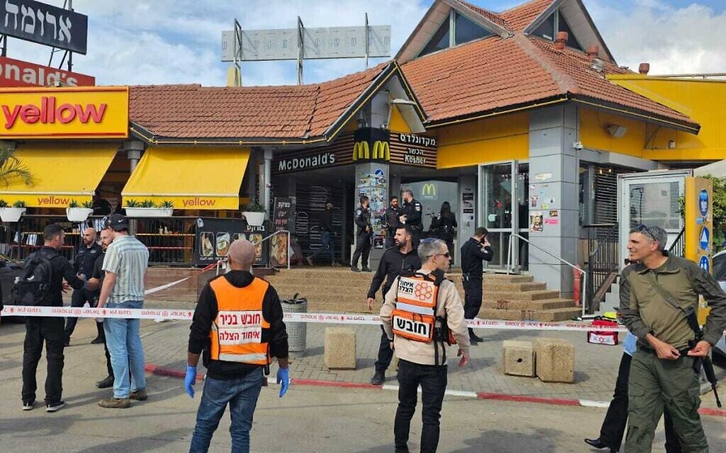 Medics and security forces at the scene of a terror stabbing attack at Beit Kama junction in southern Israel, March 14, 2024. (United Hatzalah)