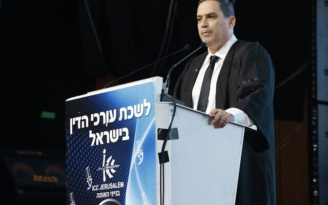 Head of the Israel Bar Association (IBA) Amit Becher addresses an IBA ceremony, March 20, 2024. (Courtesy Israel Bar Association/Yossi Zamir) Head of the Israel Bar Association (IBA) Amit Becher addresses an IBA ceremony, March 20, 2024. (Courtesy Israel Bar Association/Yossi Zamir)