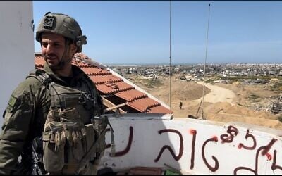 Lt. Col. Ofir Caspi, commander of the 82nd Armored Brigade, looks out on Khan Younis, March 21, 2024 (Lazar Berman/Times of Israel)