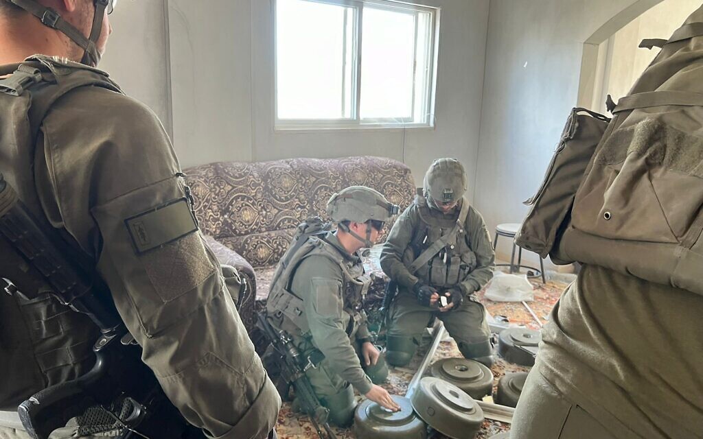 Soldiers from the 603rd Combat Engineering Battalion prepares a home for demolition, March 21, 2024 (Lazar Berman/The Times of Israel)