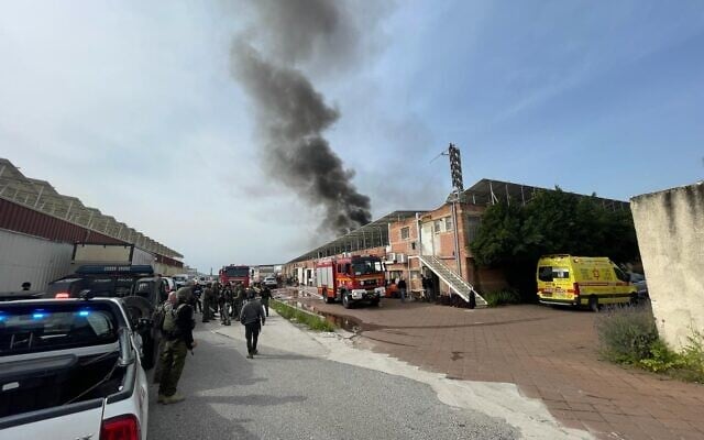 Firefighters and medics at the scene of a deadly rocket strike in Kiryat Shmona on March 27, 2024. (Magen David Adom)