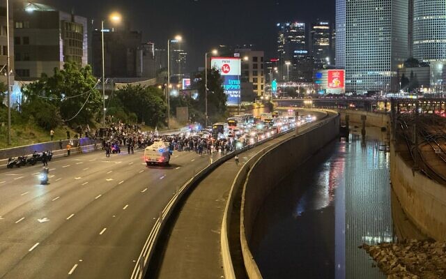 In a photo released by anti-government activists, protesters calling for a deal to release hostages held by Hamas in the Gaza Strip block the Ayalon Highway in Tel Aviv, March 30, 2024. (Rony Shapiro)