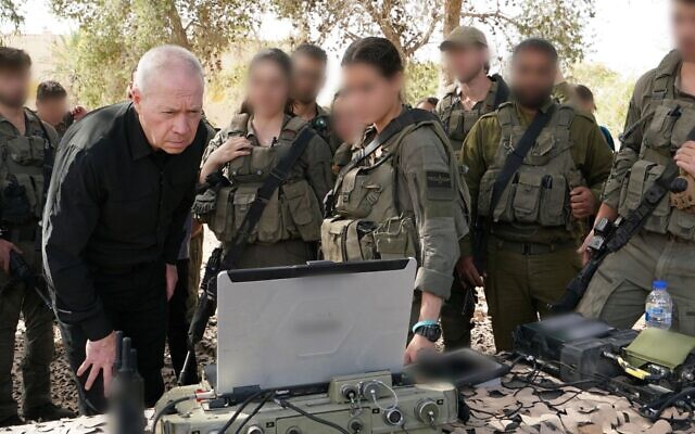 Defense Minister Yoav Gallant meets with troops at an army base, March 31, 2024. (Ariel Hermoni/Defense Ministry)
