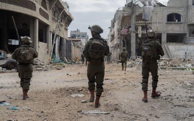 Troops of the 401st Armored Brigade operate in Gaza City's Zeitoun, in a handout image published by the IDF on March 3, 2024. (Israel Defense Forces)