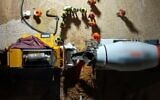 Workers pour concrete in a Hamas tunnel in northern Gaza in an undated photo released by the military on March 5, 2024. (Israel Defense Forces)
