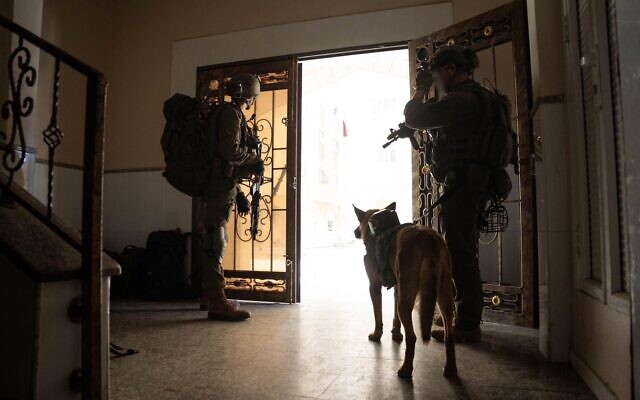 Troops operate in the Hamad Town residential complex in southern Gaza’s Khan Younis, in a handout image published by the IDF, March 7, 2024. (Israel Defense Forces)