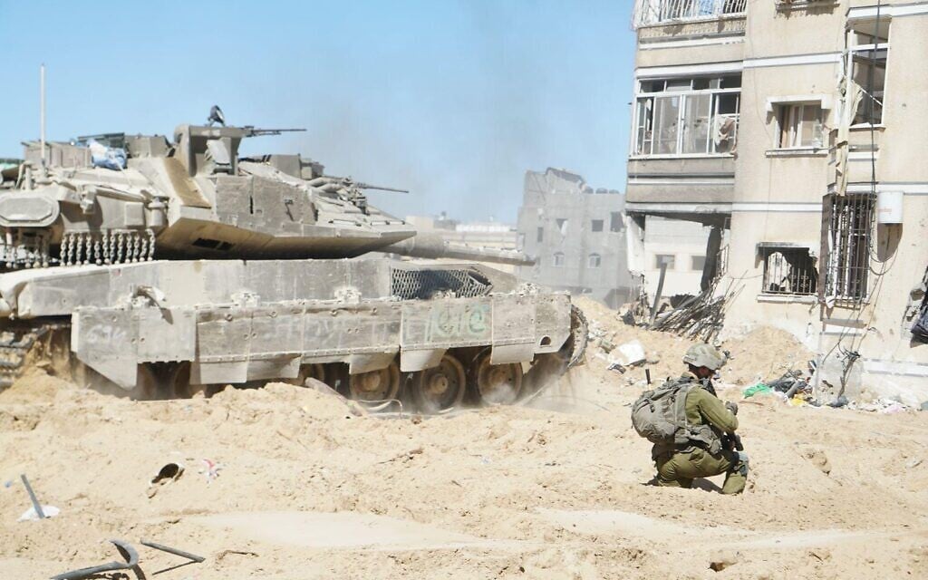 Troops of the 7th Armored Brigade operate in the Hamad Town residential complex in Khan Younis, in a handout image published March 11, 2024. (Israel Defense Forces)