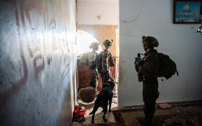 IDF troops operate in the Gaza Strip in an undated handout photo released on March 30, 2024. (Israel Defense Forces)