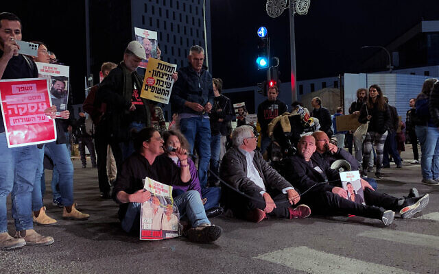 Protesters in support of a hostage deal block road in Jerusalem outside Prime Minister's Office on March 17, 2024. (Charlie Summers/Times of Israel)