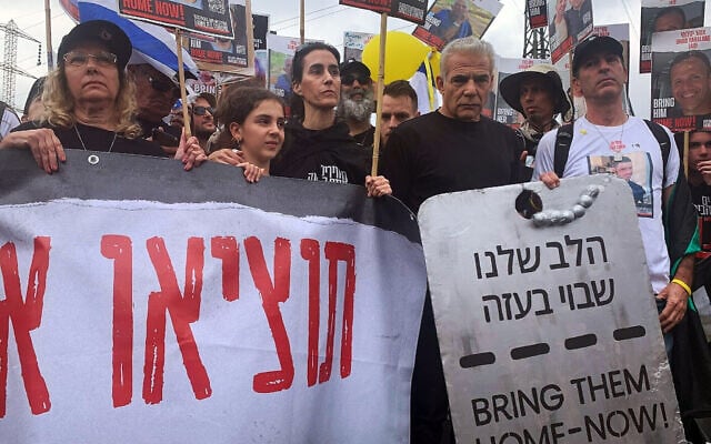 Opposition leader Yair Lapid at the 'unity march' from Re'im to Jerusalem on March 2, 2024. (Charlie Summers/Times of Israel) Opposition leader Yair Lapid at the 'unity march' from Re'im to Jerusalem on March 2, 2024. (Charlie Summers/Times of Israel)
