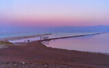 Sunset over the Dead Sea coast as seen from the Ein Bokek beach, January 19, 2024. (RnDmS / Shutterstock.com)
