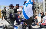 Activists blocking the Nitzana crossing to Gaza are forcibly removed by police during protests against the transfer of humanitarian aid by Israel, April 11, 2024. (Courtesy Tzav 9)