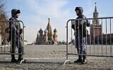 Russian law enforcement officers stand guard at the Red Square in Moscow on March 29, 2024. (NATALIA KOLESNIKOVA / AFP)