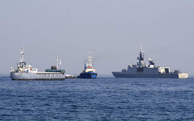 File: The barge Jennifer, part of a three ship flotilla carrying food aid for the Gaza Strip, sails next to the French frigate Courbet as the flotilla departs the port of Larnaca in Cyprus on March 30, 2024. (Iakovos Hatzistavrou/AFP) File: The barge Jennifer, part of a three ship flotilla carrying food aid for the Gaza Strip, sails next to the French frigate Courbet as the flotilla departs the port of Larnaca in Cyprus on March 30, 2024. (Iakovos Hatzistavrou/AFP)