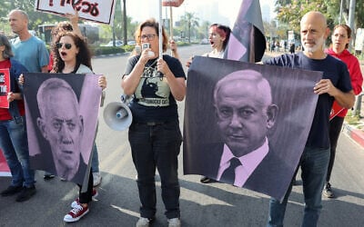 Relatives and supporters of Israeli hostages held in Gaza since the October 7 attacks by Hamas hold placards during a demonstration in Tel Aviv, on April 4, 2024. (Jack Guez/AFP)