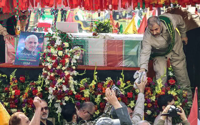 Iranians attend the funeral of seven Islamic Revolutionary Guard Corps members killed in a strike on the country's consular annex in Damascus, which Tehran blamed on Israel, on April 5, 2024, during their funeral procession in Tehran. (Atta Kenare/AFP)