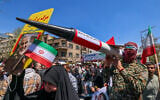 Illustrative: Iranians attend the funeral procession for seven Islamic Revolutionary Guard Corps members killed in a strike in Syria, which Iran blamed on Israel, in Tehran on April 5, 2024. (Atta Kenare/AFP)